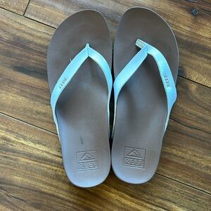 White leather reef flip flops.  Never worn